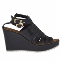 Woman's platform strap sandal with intertwined straps in black leather wedge 9