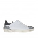 Woman's laced sports shoe in black and white leather and printed leather wedge heel 2