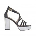 Woman's open strap shoe in black leather with platform and heel 10 in silver patent leather