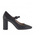 Woman's pump with strap in black leather heel 8