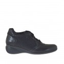 Woman's shoe with laces in black leather and printed leather wedge heel 5