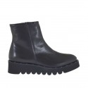 Damenstiefelette mit Reissverschluss und Nieten aus schwarzem Leder Keilabsatz 4
