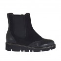 Woman's ankle boot with zipper and elastic band in black leather and suede wedge heel 3
