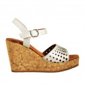 Woman's strap sandal in pearled silver pierced leather with platform and wedge 9