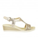 Woman's sandal in platinum printed and pierced leather wedge heel 4