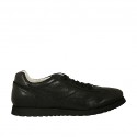 Laced sports shoe for men in black leather and pierced leather