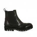 Woman's ankle boot with elastic bands and wingtip in black leather with heel 3