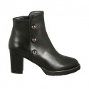 Woman's ankle boot with zipper and studs in black leather heel 7