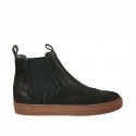 Botines para hombre en piel de color negro con elasticos verdes y decoración Brogue