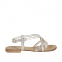 Woman's flip-flop sandal with crossed straps in platinum laminated leather heel 1