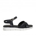 Woman's strap sandal in black leather wedge heel 2