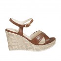 Woman's strap sandal in brown leather and braided fabric with platform and wedge 9