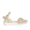 Woman's strap sandal in copper laminated leather with rocklike texture and wedge heel 2