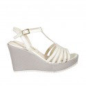 Woman's T-strap sandal in white leather and silver laminated fabric with platform and wedge heel 9