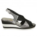 Woman's sandal in black and silver laminated printed leather with elastic band wedge heel 6