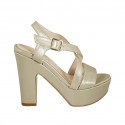 Woman's laminated platinum strap sandal with platform heel 12