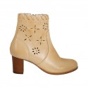 Woman's ankle boot with zipper in beige leather and pierced leather heel 6