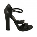 Woman's open shoe with strap and buckle in black leather heel 11