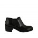 Woman's highfronted shoe with elastic bands in black brush-off leather heel 5