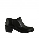 Woman's highfronted shoe with elastic bands in black brush-off leather heel 5