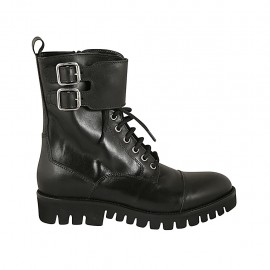 Woman's laced combat style ankle boot with zipper, captoe and buckles in black leather heel 3