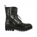 Woman's laced combat style ankle boot with zipper, captoe and buckles in black leather heel 3