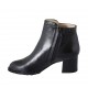 Woman's ankle boot with zipper and studs in black leather heel 5