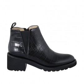Woman's ankle boot with zipper, studs and elastic band in black printed leather heel 5