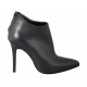 Woman's pointy ankle boot with posterior zipper in black leather heel 10