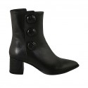 Woman's pointy ankle boot with zipper and buttons in black leather and printed leather heel 6
