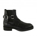 Woman's ankle boot with elastic bands and buckle in black leather heel 3