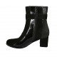 Woman's ankle boot with zipper and buckle in black and spotted suede and black patent leather heel 6