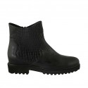 Woman's ankle boot with zipper in black leather and printed leather heel 3