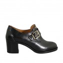 Woman's highfronted shoe with buckle and studs in black leather heel 6