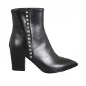 Woman's pointy ankle boot with zipper and studs in black leather heel 7